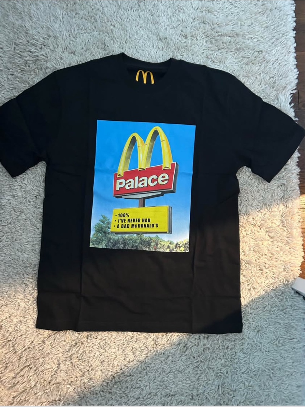 PALACE Black Tee with Yellow McDonald's-Inspired Sign Graphic